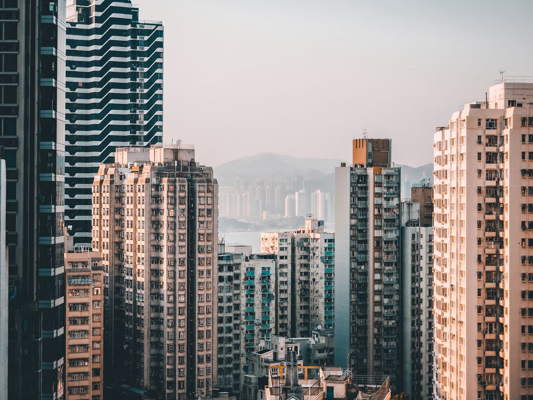 high rise buildings under the gray sky
